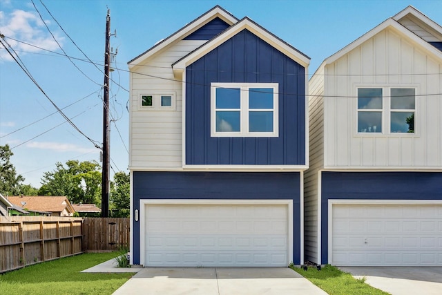 4211 Faulkner St, Houston, TX 77021 - view of front of property with an attached garage, concrete driveway, and board and batten siding