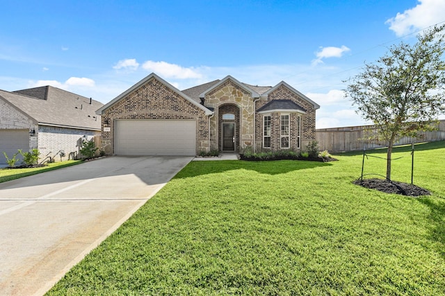 104 Dina Ln, Montgomery, TX 77356 - french country style house with a garage, brick siding, concrete driveway, and stone siding