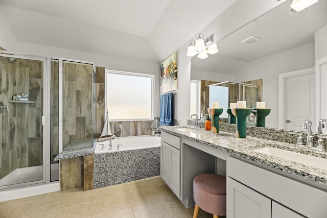 104 Dina Ln, Montgomery, TX 77356 - bathroom featuring double vanity, a garden tub, a shower stall, tile patterned floors, and a chandelier