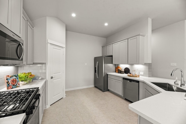 104 Dina Ln, Montgomery, TX 77356 - kitchen with stainless steel appliances, a sink, recessed lighting, decorative backsplash, and light countertops
