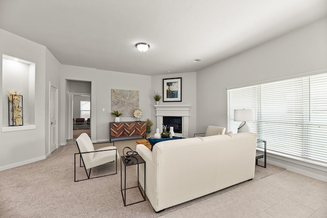 104 Dina Ln, Montgomery, TX 77356 - living room with healthy amount of natural light, baseboards, and a glass covered fireplace