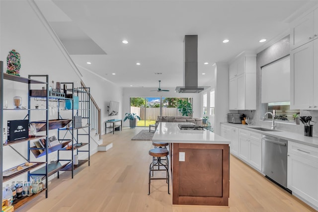 831 E 26th St, Houston, TX 77009 - kitchen with appliances with stainless steel finishes, a sink, exhaust hood, open floor plan, and ceiling fan
