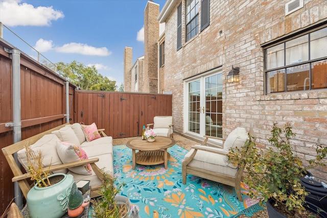738 Augusta Dr Unit 312, Houston, TX 77057 - fenced backyard with an outdoor living space, french doors, and a patio area