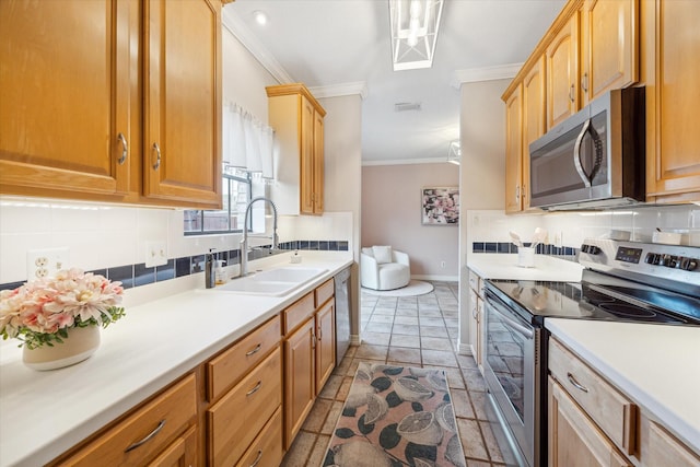 738 Augusta Dr Unit 312, Houston, TX 77057 - kitchen with appliances with stainless steel finishes, crown molding, a sink, baseboards, and decorative backsplash