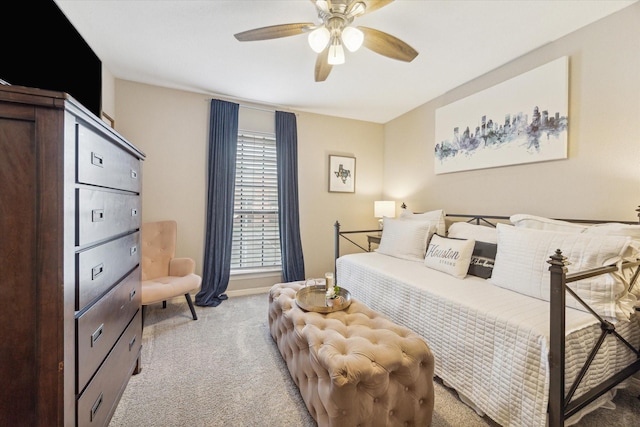 738 Augusta Dr Unit 312, Houston, TX 77057 - bedroom with light carpet and a ceiling fan