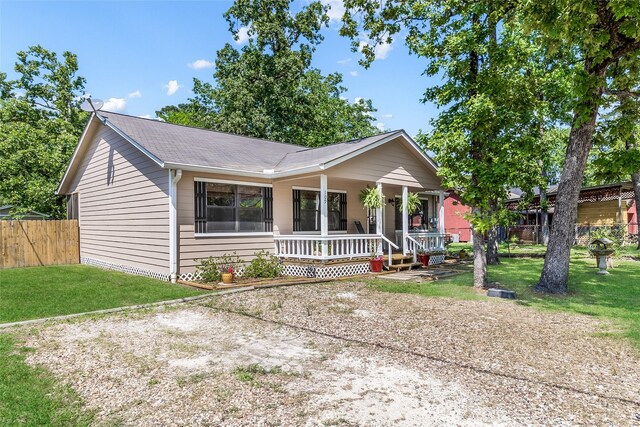 109 Teena Ln, Livingston, TX 77351 - ranch-style house with covered porch