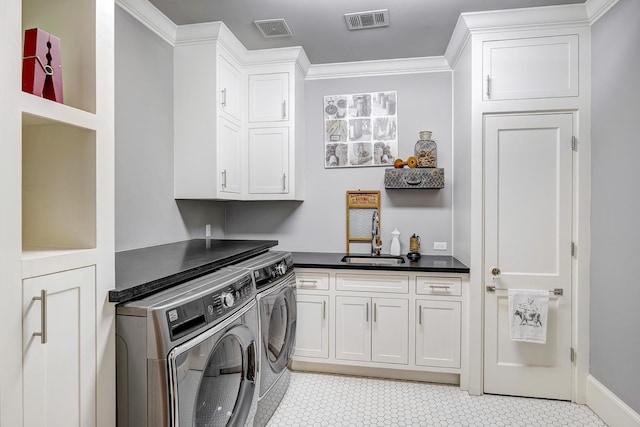 1811 Harvard St, Houston, TX 77008 - laundry area with washing machine and dryer, cabinet space, and crown molding