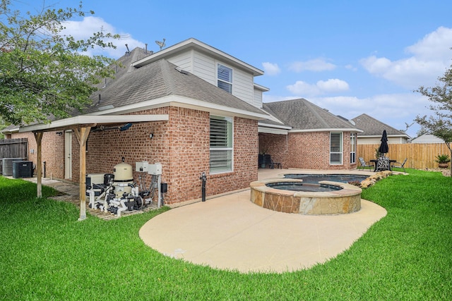 12631 Midland Creek Dr, Tomball, TX 77377 - rear view of property with a patio, brick siding, and a shingled roof