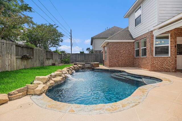 12631 Midland Creek Dr, Tomball, TX 77377 - view of pool with a fenced backyard, a pool with connected hot tub, and a patio area