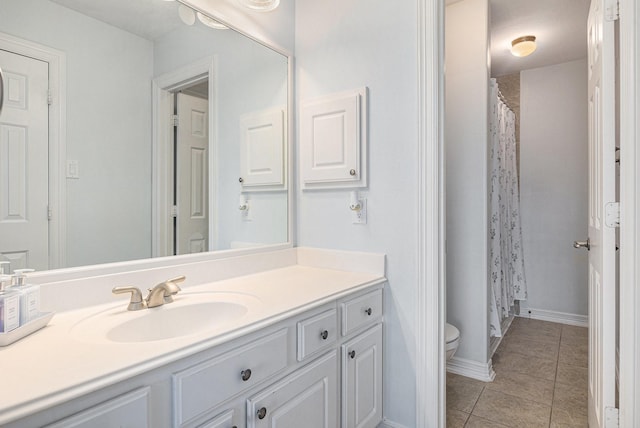 12631 Midland Creek Dr, Tomball, TX 77377 - bathroom featuring vanity, tile patterned flooring, toilet, curtained shower, and baseboards