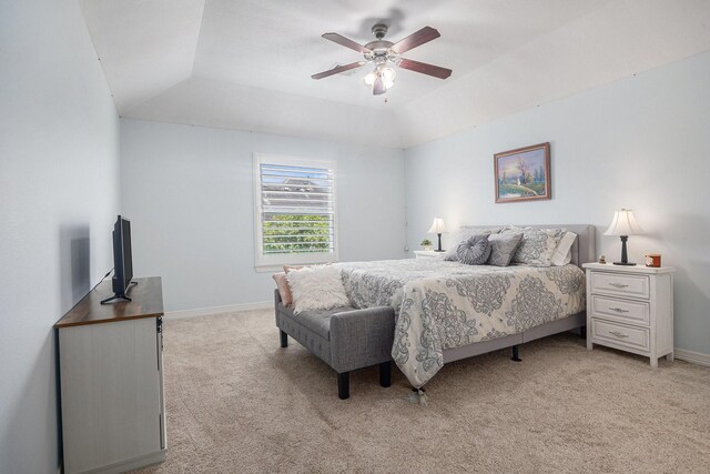 12631 Midland Creek Dr, Tomball, TX 77377 - bedroom featuring light colored carpet, a tray ceiling, baseboards, and a ceiling fan