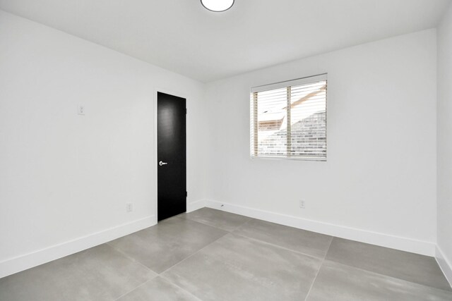8906 Enchanted Forest Dr, Houston, TX 77088 - spare room with baseboards and concrete flooring