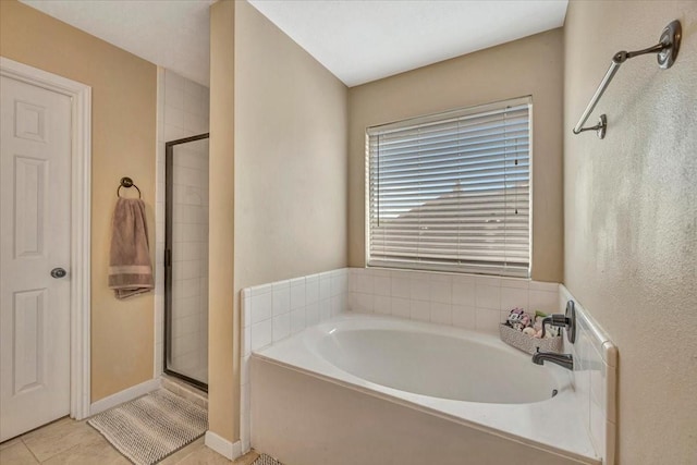 4235 Park Ridge Dr, Pasadena, TX 77504 - bathroom featuring a shower stall, a garden tub, and tile patterned flooring
