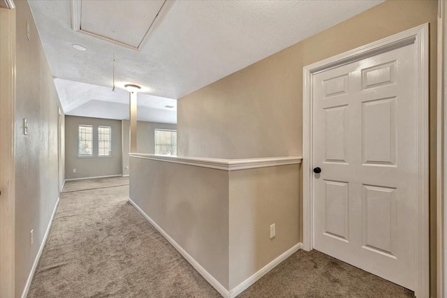 4235 Park Ridge Dr, Pasadena, TX 77504 - hall with attic access, carpet, a textured ceiling, and lofted ceiling