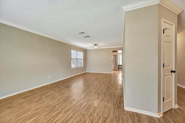 4235 Park Ridge Dr, Pasadena, TX 77504 - spare room featuring light wood-type flooring and crown molding