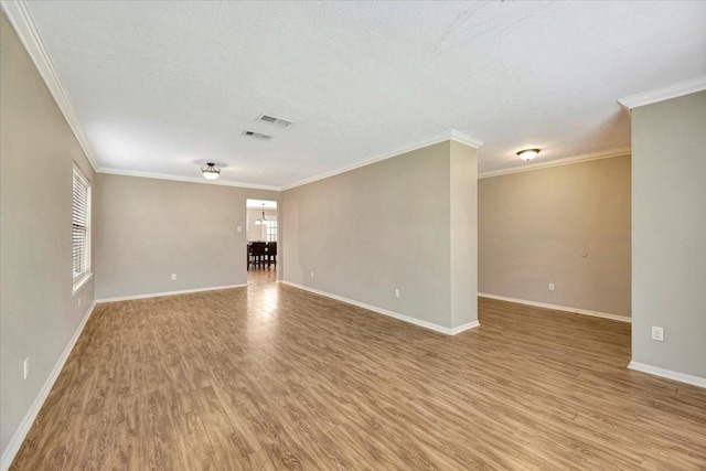 4235 Park Ridge Dr, Pasadena, TX 77504 - unfurnished room featuring light wood-style flooring and ornamental molding