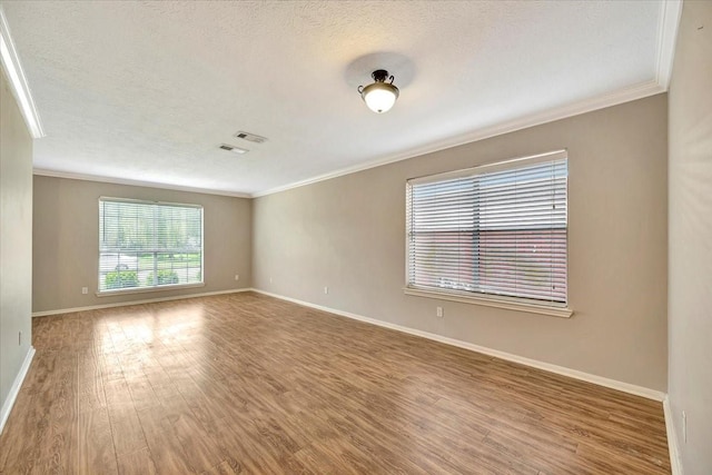 4235 Park Ridge Dr, Pasadena, TX 77504 - spare room with crown molding, wood finished floors, and a textured ceiling