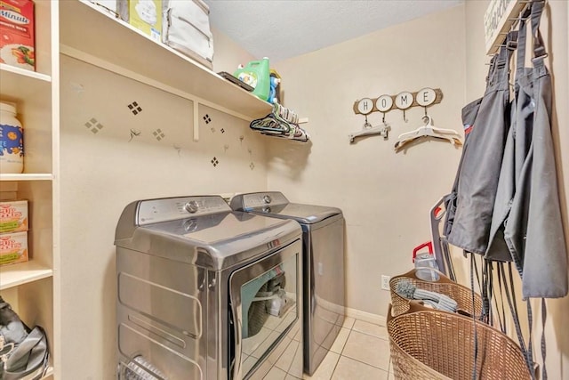 4235 Park Ridge Dr, Pasadena, TX 77504 - laundry room featuring washing machine and clothes dryer and tile patterned floors