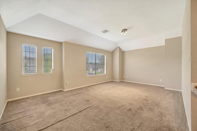 4235 Park Ridge Dr, Pasadena, TX 77504 - empty room featuring carpet flooring, plenty of natural light, and lofted ceiling