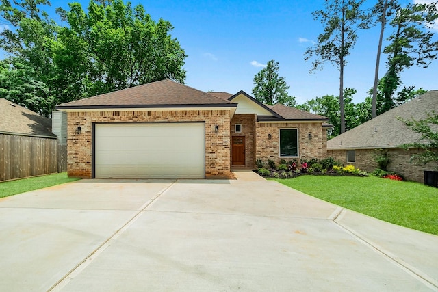 3518 Misty Moss, Montgomery, TX 77356 - single story home featuring driveway, brick siding, an attached garage, and roof with shingles