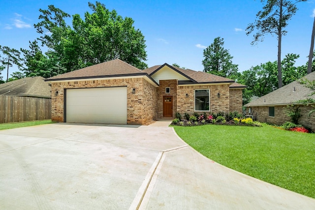 3518 Misty Moss, Montgomery, TX 77356 - single story home with driveway, an attached garage, brick siding, and roof with shingles