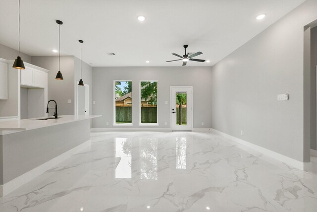3518 Misty Moss, Montgomery, TX 77356 - unfurnished living room featuring a sink, light marble finish flooring, recessed lighting, baseboards, and a ceiling fan