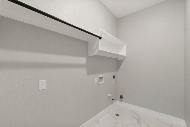 3518 Misty Moss, Montgomery, TX 77356 - laundry room featuring hookup for a gas dryer, baseboards, hookup for an electric dryer, washer hookup, and marble finish floors