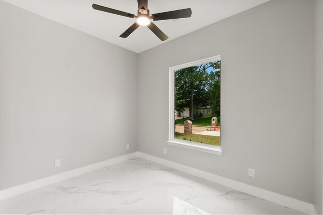 3518 Misty Moss, Montgomery, TX 77356 - spare room featuring marble finish flooring, baseboards, and a ceiling fan