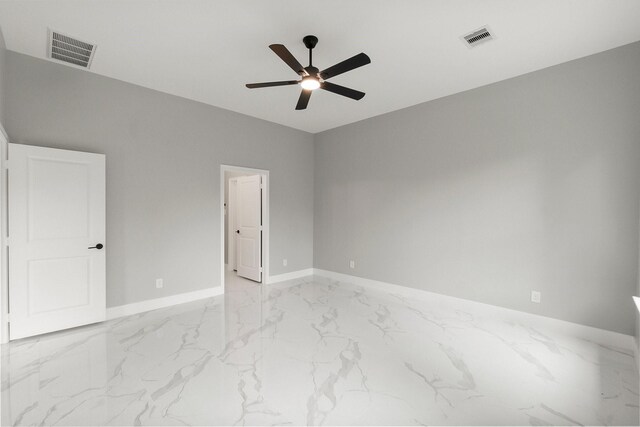 3518 Misty Moss, Montgomery, TX 77356 - unfurnished room featuring ceiling fan, marble look tile flooring, and baseboards