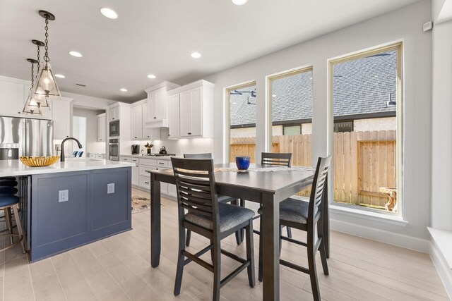 454 Patina Dr, Montgomery, TX 77316 - dining area featuring light wood finished floors, recessed lighting, and baseboards