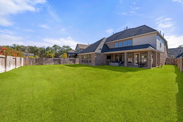 454 Patina Dr, Montgomery, TX 77316 - rear view of property featuring brick siding, a patio, and roof with shingles