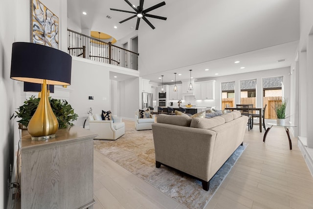 454 Patina Dr, Montgomery, TX 77316 - living area with a ceiling fan, recessed lighting, light wood-type flooring, and a towering ceiling