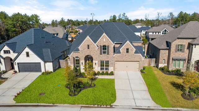 454 Patina Dr, Montgomery, TX 77316 - french provincial home featuring driveway, brick siding, a residential view, and a shingled roof