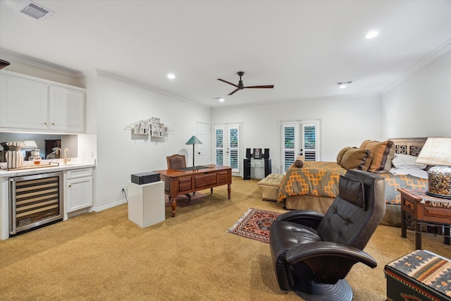 5710 Logan Ln, Houston, TX 77007 - living room with beverage cooler, ornamental molding, light carpet, recessed lighting, and bar with sink