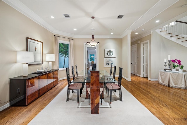 5710 Logan Ln, Houston, TX 77007 - dining area with light wood-type flooring, ornamental molding, stairway, recessed lighting, and baseboards