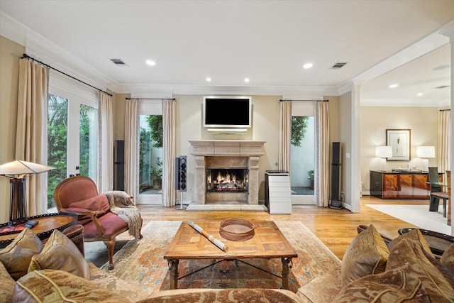 5710 Logan Ln, Houston, TX 77007 - living area with wood finished floors, crown molding, a premium fireplace, recessed lighting, and baseboards