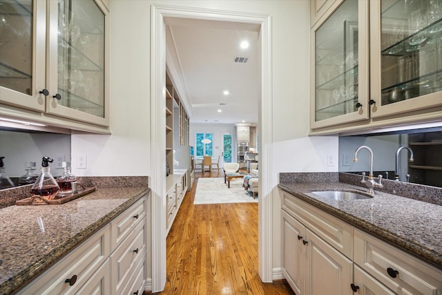 5710 Logan Ln, Houston, TX 77007 - bar featuring a sink, light wood finished floors, and recessed lighting