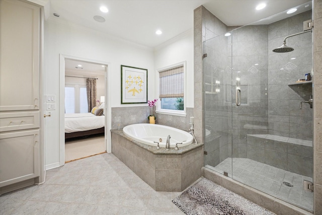 5710 Logan Ln, Houston, TX 77007 - full bathroom with crown molding, a garden tub, a stall shower, connected bathroom, and tile patterned flooring