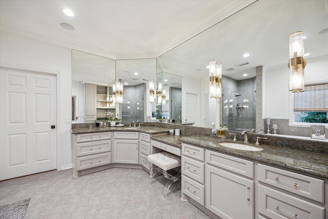 5710 Logan Ln, Houston, TX 77007 - bathroom with a stall shower, vanity, and ornamental molding