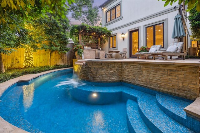 5710 Logan Ln, Houston, TX 77007 - view of swimming pool with exterior kitchen and a fenced backyard