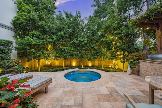 5710 Logan Ln, Houston, TX 77007 - pool at dusk with a fenced backyard, a patio, and an in-ground hot tub