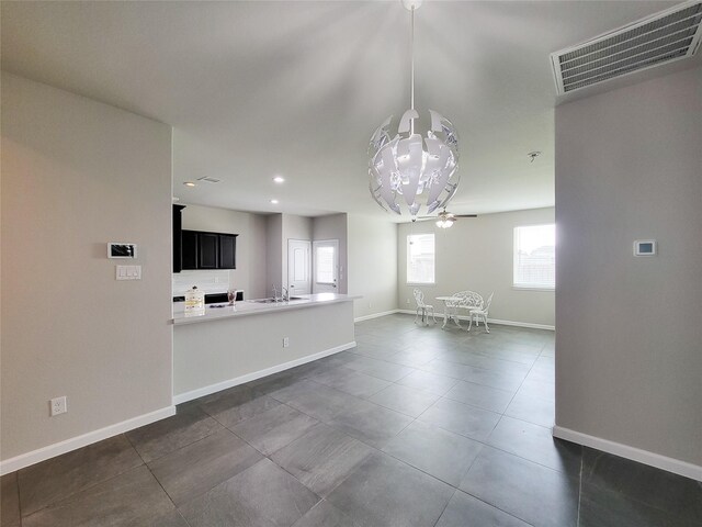 5426 Redwood Summit Ln, Katy, TX 77449 - unfurnished living room with healthy amount of natural light, ceiling fan, recessed lighting, and dark tile patterned floors