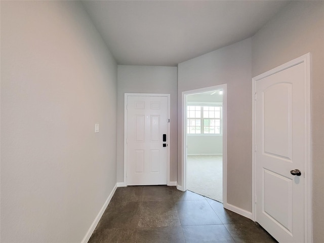 5426 Redwood Summit Ln, Katy, TX 77449 - foyer with baseboards and dark tile patterned floors