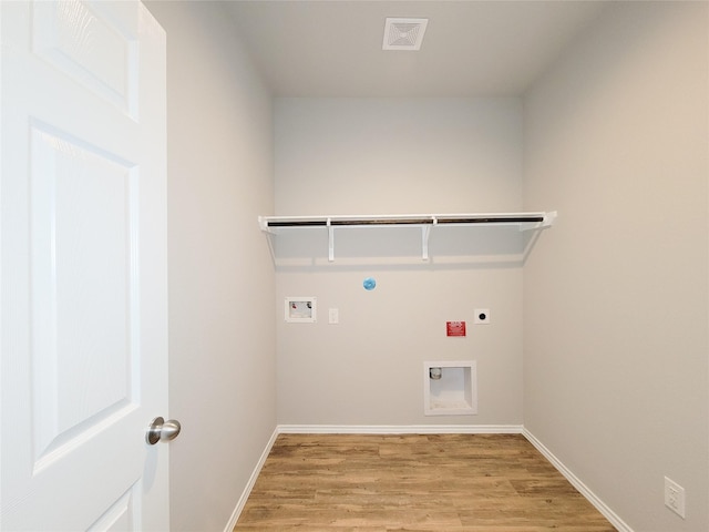 5426 Redwood Summit Ln, Katy, TX 77449 - laundry area with electric dryer hookup, light wood-style flooring, washer hookup, and gas dryer hookup
