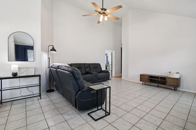 5551 Fawn Trail Ln, Humble, TX 77346 - living room with ceiling fan, high vaulted ceiling, light tile patterned flooring, and baseboards