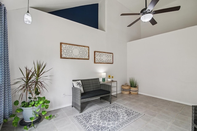 5551 Fawn Trail Ln, Humble, TX 77346 - living area with ceiling fan, high vaulted ceiling, tile patterned floors, and baseboards