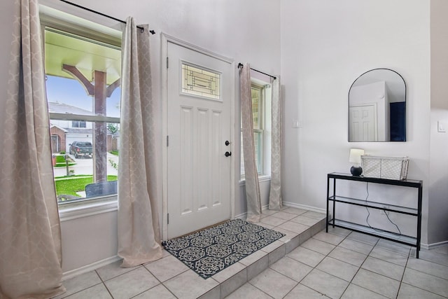 5551 Fawn Trail Ln, Humble, TX 77346 - entryway with baseboards and tile patterned floors