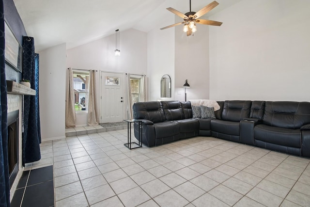 5551 Fawn Trail Ln, Humble, TX 77346 - living area with high vaulted ceiling, ceiling fan, light tile patterned floors, and a fireplace