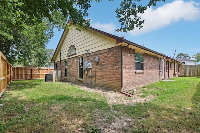 5551 Fawn Trail Ln, Humble, TX 77346 - rear view of house featuring brick siding and central AC