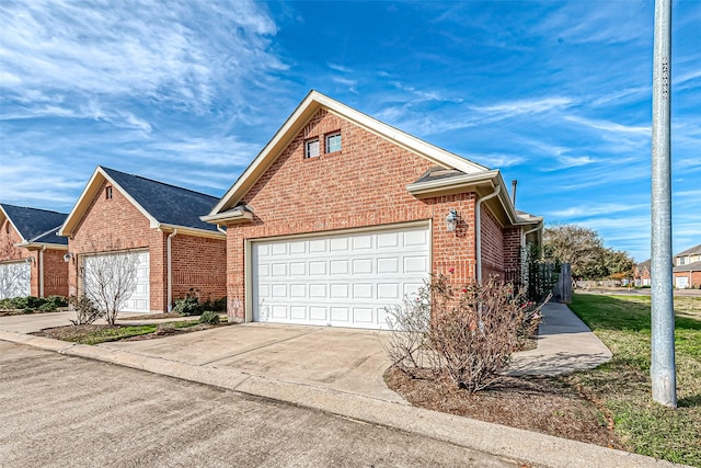 20904 Sunrise Pine View Ln, Katy, TX 77450 - view of front of house featuring brick siding, concrete driveway, and a garage
